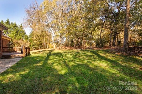 view of yard featuring a deck