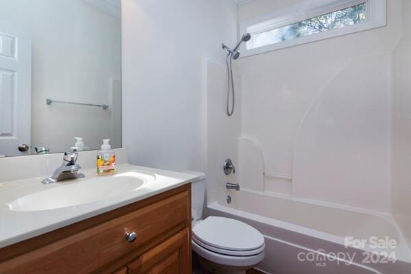 full bathroom with vanity, bathtub / shower combination, and toilet