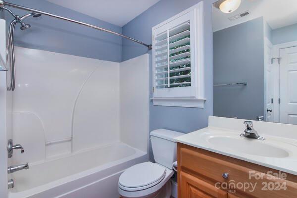 full bathroom with vanity, toilet, and shower / bath combination