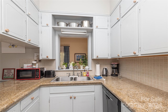 kitchen featuring decorative backsplash, stainless steel dishwasher, sink, and white cabinets