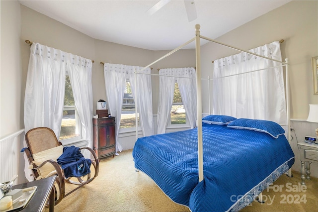 carpeted bedroom featuring ceiling fan