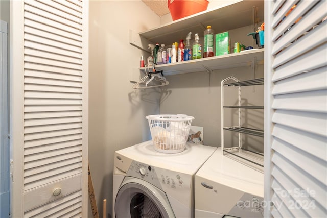 washroom featuring washer and dryer