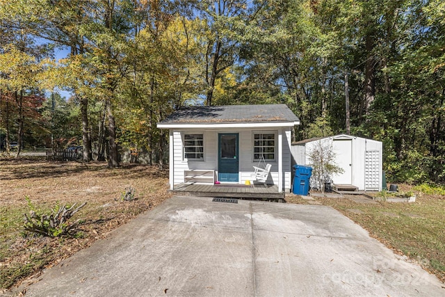 view of outbuilding featuring covered porch