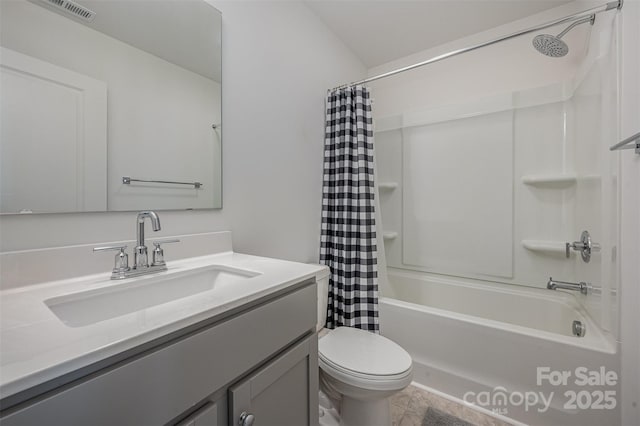 bathroom featuring visible vents, vanity, toilet, and shower / bath combo with shower curtain