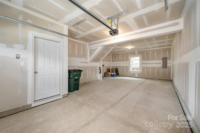 garage featuring a garage door opener and electric panel