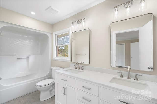 full bathroom featuring toilet, shower / tub combination, vanity, and tile patterned floors