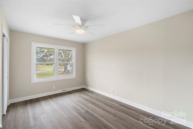 spare room featuring ceiling fan and hardwood / wood-style floors