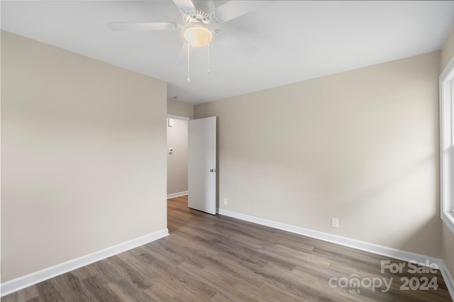 spare room featuring ceiling fan and hardwood / wood-style flooring