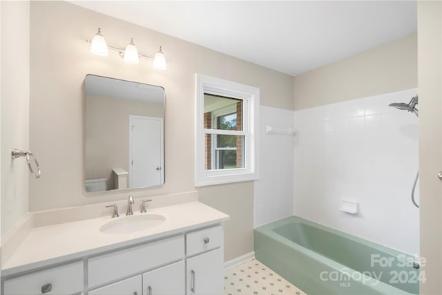 bathroom featuring vanity and shower / tub combination