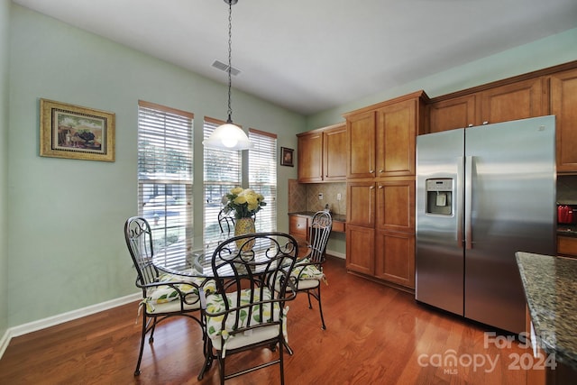 dining area featuring dark hardwood / wood-style flooring