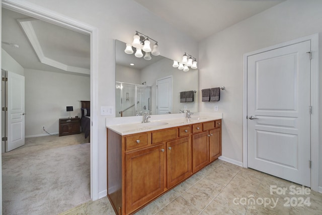 bathroom featuring vanity, tile patterned floors, and an enclosed shower