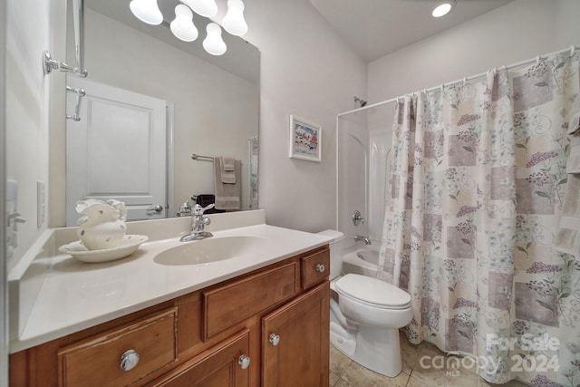 full bathroom with tile patterned flooring, vanity, shower / bath combo, and toilet