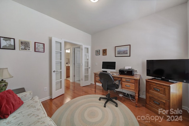 office space featuring french doors and light wood-type flooring