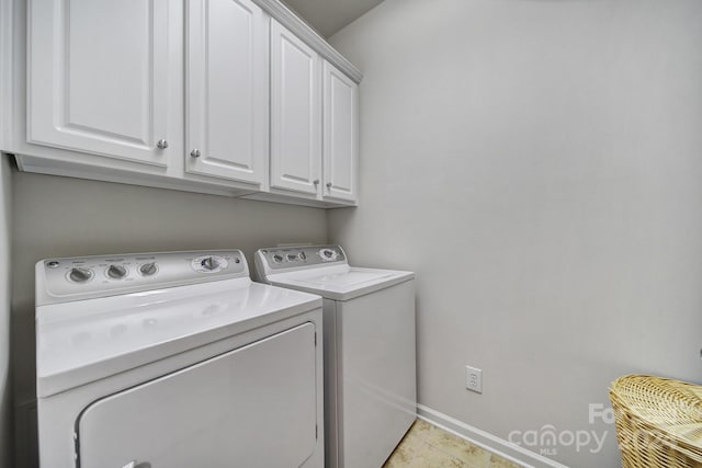 laundry area with light tile patterned flooring, cabinets, and independent washer and dryer