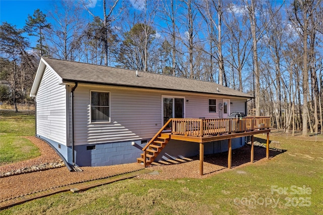 rear view of property with a lawn and a deck