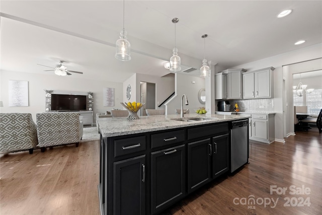 1568 Whitman Ct, York, SC 29745 - kitchen with stainless steel dishwasher, dark wood finished floors, a ceiling fan, open floor plan, and a kitchen island with sink