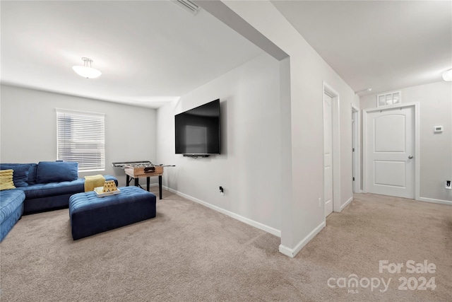 living room featuring light carpet