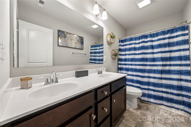 1568 Whitman Ct, York, SC 29745 - bathroom with double vanity, stone finish floors, and curtained shower
