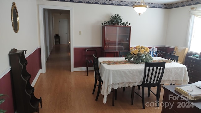 dining space featuring hardwood / wood-style flooring