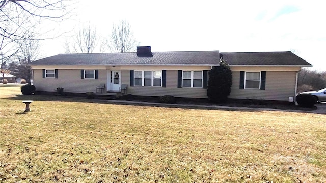 single story home with a front lawn