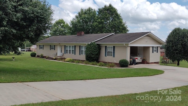 single story home with a carport and a front lawn