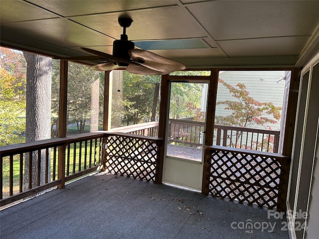 exterior space with ceiling fan