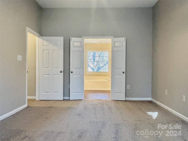 unfurnished bedroom featuring carpet floors