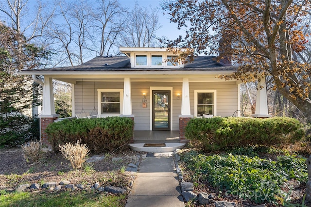 bungalow-style house featuring covered porch