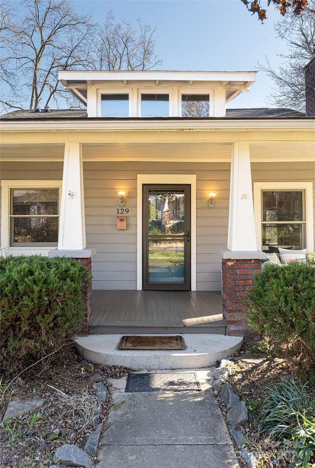 doorway to property with covered porch