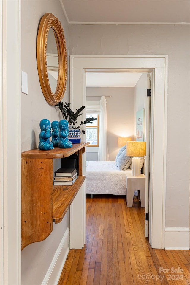 bedroom with hardwood / wood-style floors