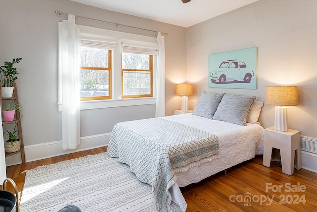 bedroom featuring wood-type flooring and ceiling fan