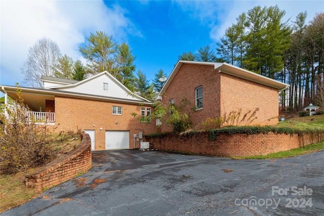 view of property exterior featuring a garage