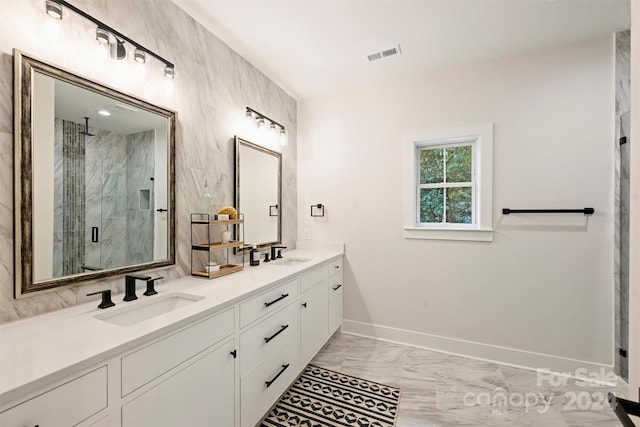 bathroom with vanity and an enclosed shower