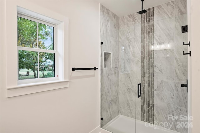 bathroom featuring an enclosed shower