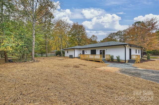 rear view of house with a wooden deck