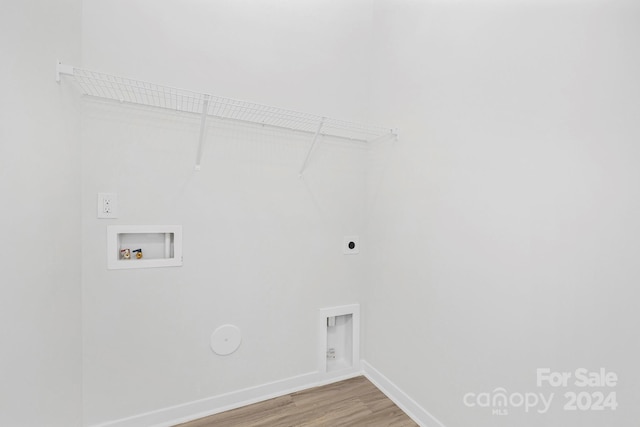 laundry room with hookup for an electric dryer, hookup for a washing machine, and hardwood / wood-style flooring