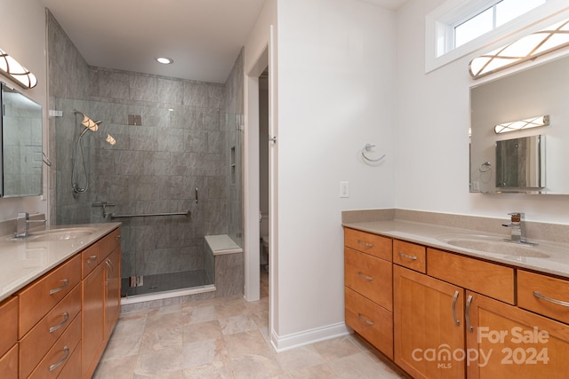 bathroom with vanity, toilet, and walk in shower