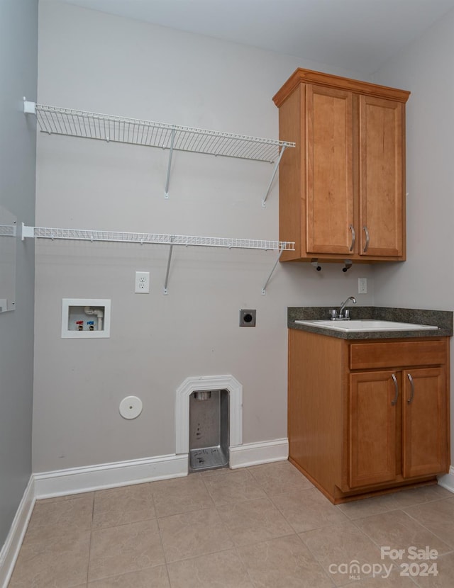 laundry room with hookup for an electric dryer, sink, light tile patterned flooring, and washer hookup