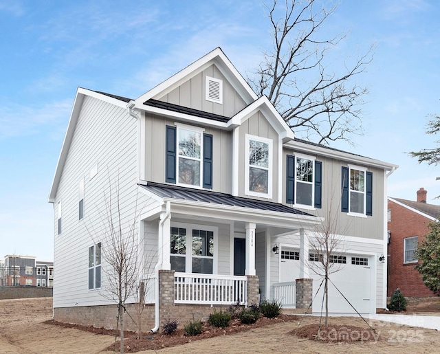 view of front of house with a garage and a porch