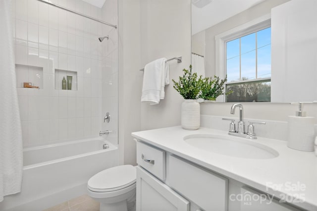 full bathroom with tile patterned flooring, vanity, shower / tub combo with curtain, and toilet