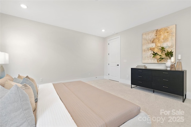 bedroom with light colored carpet