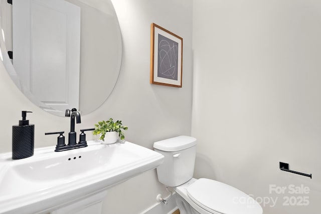 bathroom with sink and toilet