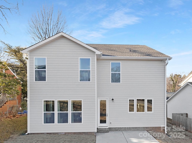 rear view of property featuring a patio area