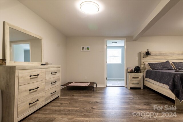 bedroom featuring dark wood-type flooring