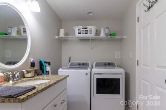 laundry area featuring sink and washer and dryer