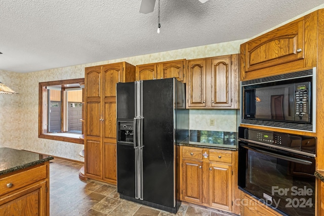 kitchen with a textured ceiling, black appliances, and ceiling fan