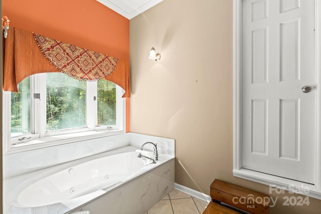 bathroom featuring ornamental molding, a tub, and tile patterned floors