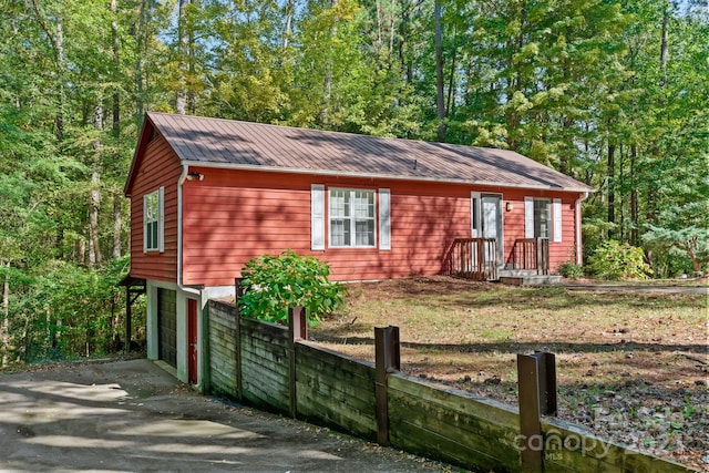 view of side of home with a garage