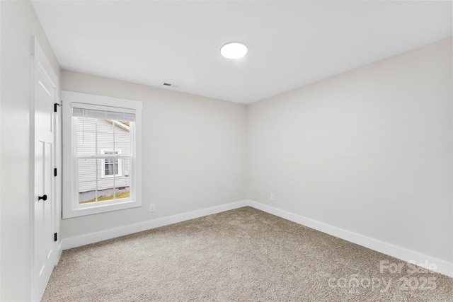 unfurnished room with carpet floors