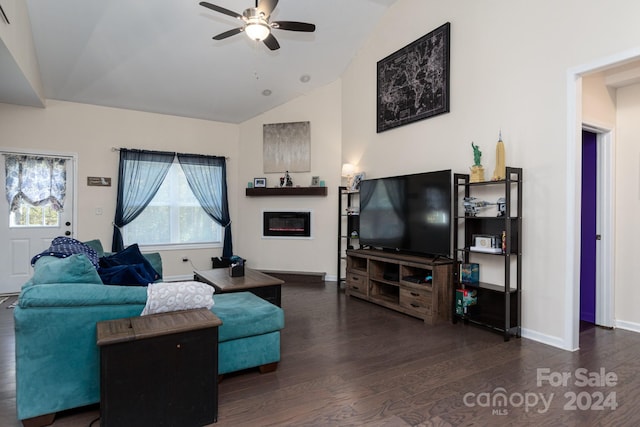 living room with ceiling fan, vaulted ceiling, and dark hardwood / wood-style floors